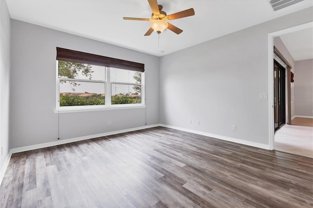 spare room with ceiling fan and hardwood / wood-style floors