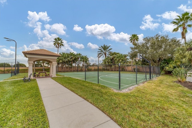 view of basketball court with a gazebo and a yard