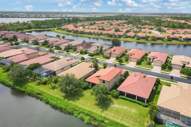 drone / aerial view with a water view