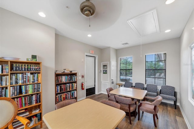 dining space with ceiling fan and hardwood / wood-style floors