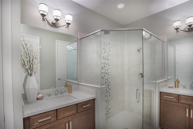 bathroom featuring vanity and an enclosed shower