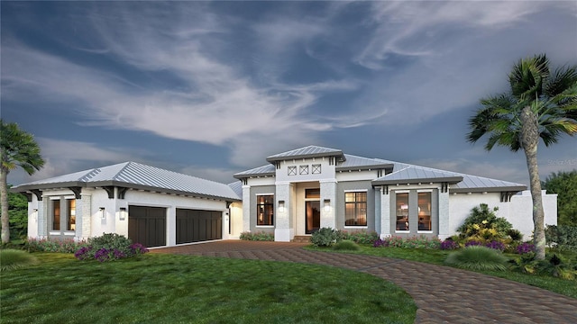 view of front of house featuring a front lawn, a garage, and french doors