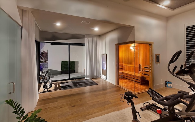 exercise room featuring hardwood / wood-style floors