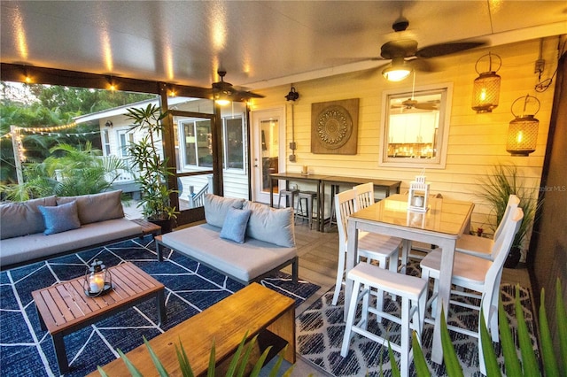 interior space with wooden walls, ceiling fan, and hardwood / wood-style flooring