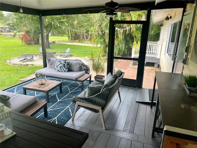 sunroom / solarium with ceiling fan