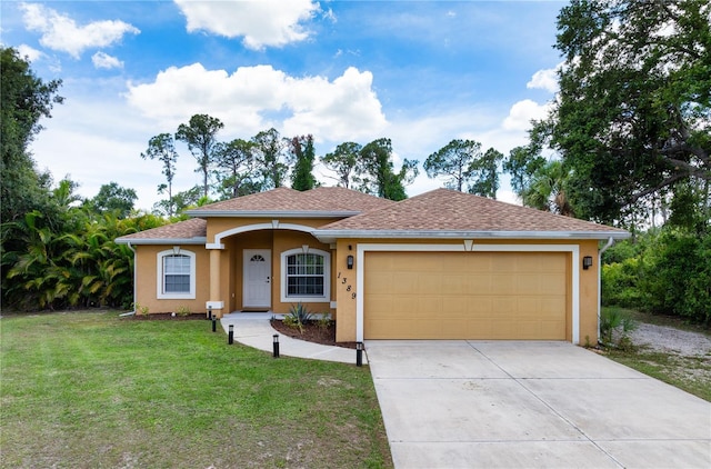 view of front of home with a front lawn and a garage