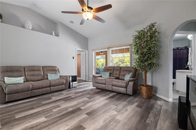 living room with lofted ceiling, ceiling fan, and hardwood / wood-style floors