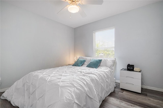 bedroom with ceiling fan and wood-type flooring