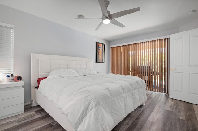 bedroom featuring access to exterior, ceiling fan, and dark hardwood / wood-style floors