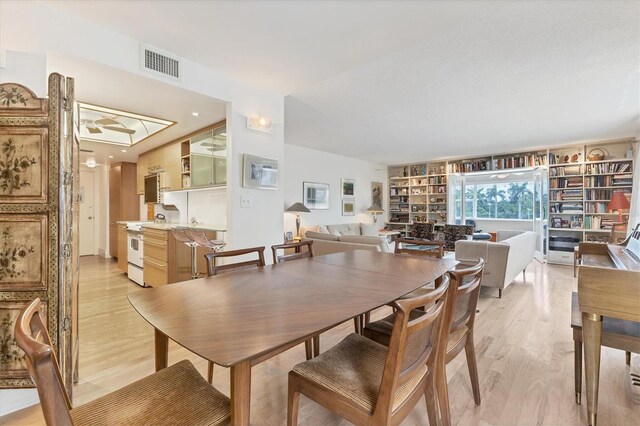 dining space with light wood-type flooring