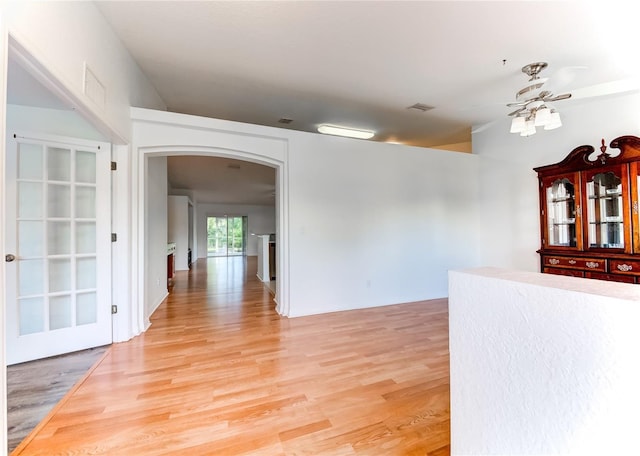 empty room featuring hardwood / wood-style flooring and ceiling fan