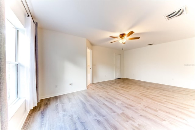 unfurnished room with ceiling fan and light hardwood / wood-style floors