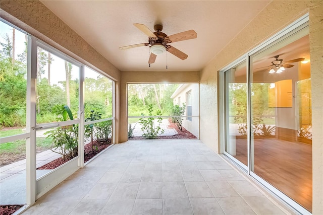 sunroom / solarium with ceiling fan