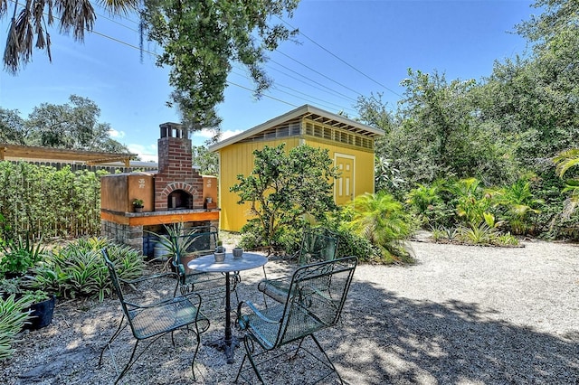 view of patio featuring exterior fireplace