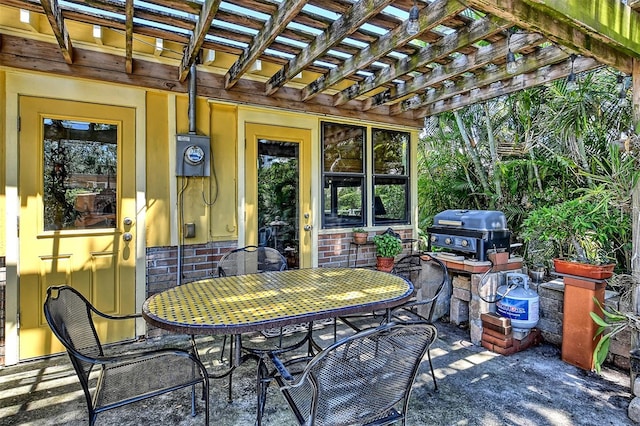 view of patio / terrace featuring a pergola and area for grilling