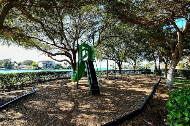 view of jungle gym featuring a water view