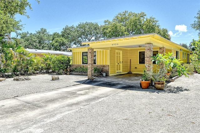 view of front facade with a carport