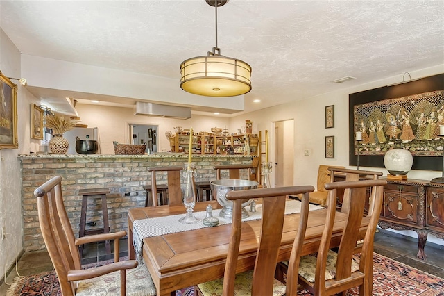 dining room with a fireplace and a wall mounted AC