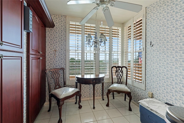 sitting room featuring light tile patterned flooring and ceiling fan