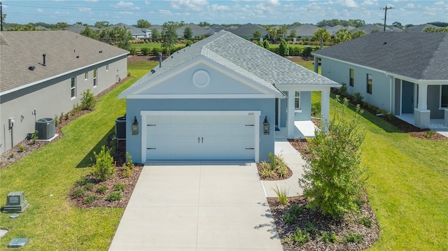 ranch-style house with a garage, central air condition unit, and a front lawn