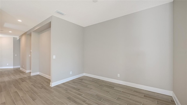 spare room featuring light hardwood / wood-style floors