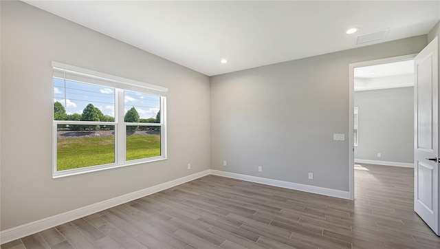 spare room featuring hardwood / wood-style floors