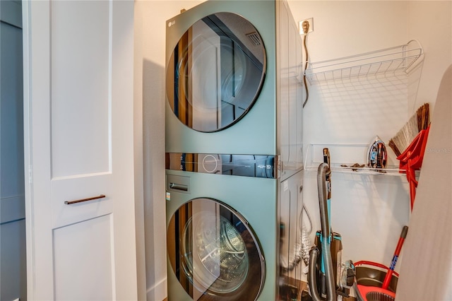 laundry room featuring stacked washer and dryer