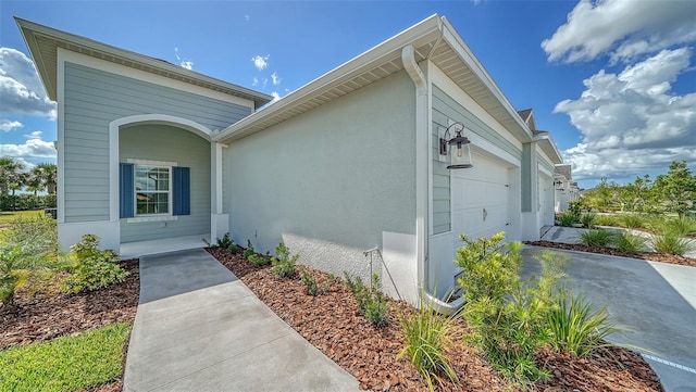 view of side of property with a garage