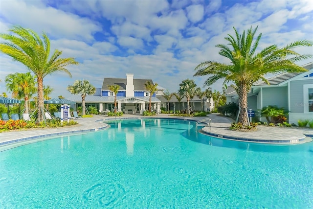 view of swimming pool with a patio area