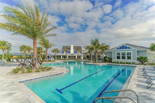 view of swimming pool with a patio