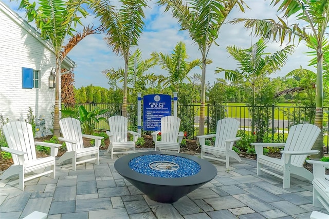 view of patio with a fire pit