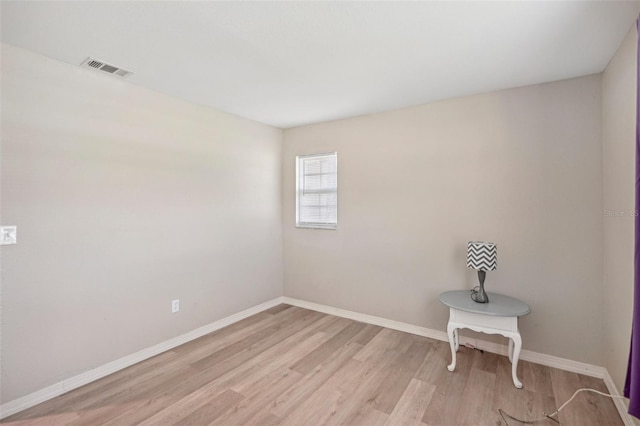 unfurnished room featuring light wood-type flooring