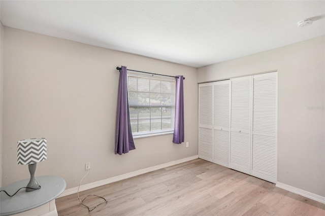 unfurnished room with light hardwood / wood-style flooring