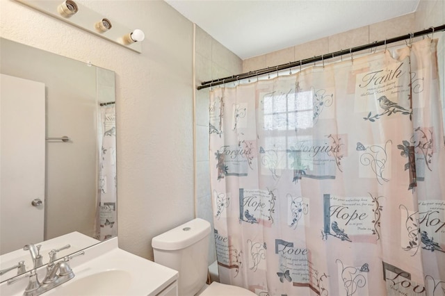 full bathroom featuring vanity, shower / tub combo, and toilet