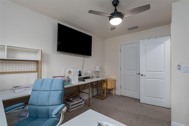 carpeted office with ceiling fan