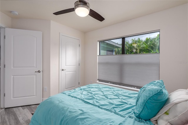 bedroom with ceiling fan and light hardwood / wood-style floors