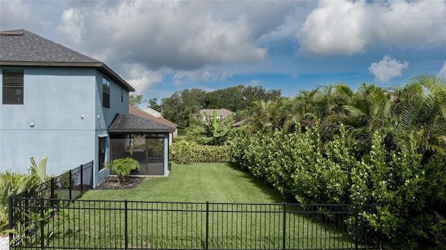 view of yard with a sunroom