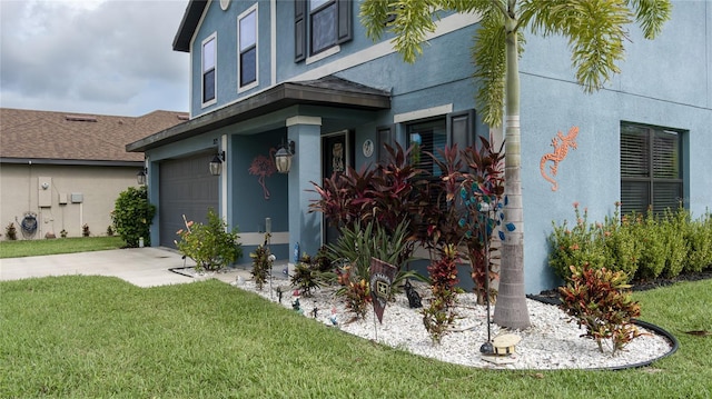 view of property exterior featuring a garage and a lawn