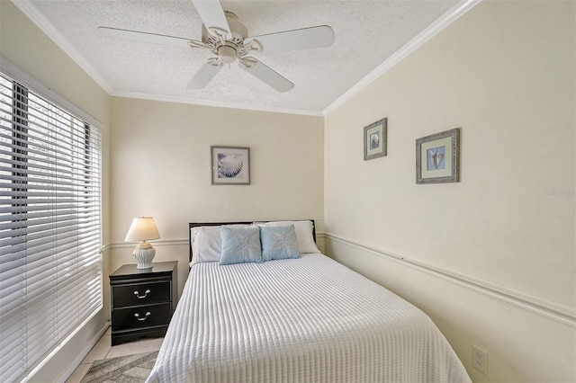 bedroom with ornamental molding, a textured ceiling, and ceiling fan