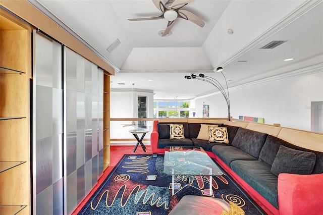 living room featuring lofted ceiling, a raised ceiling, crown molding, and ceiling fan