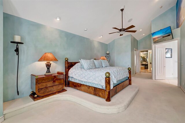 carpeted bedroom featuring lofted ceiling and ceiling fan