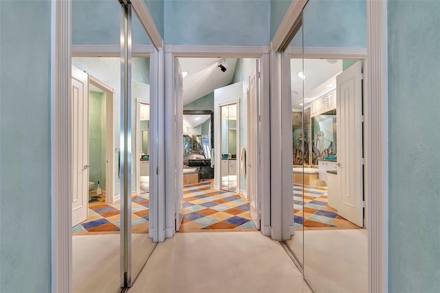 interior space featuring lofted ceiling and carpet flooring