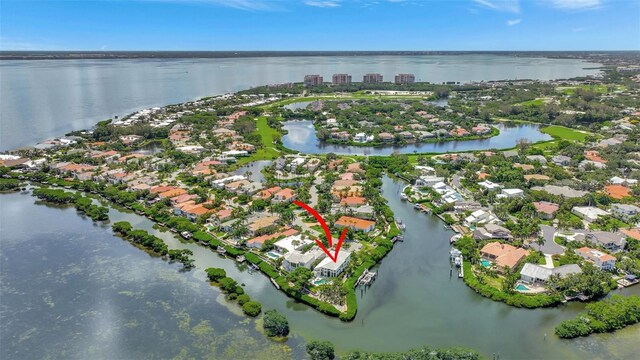 birds eye view of property featuring a water view