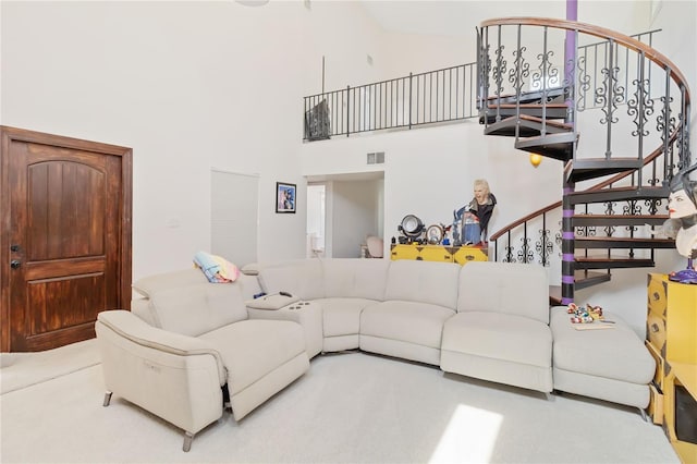 living room with a high ceiling