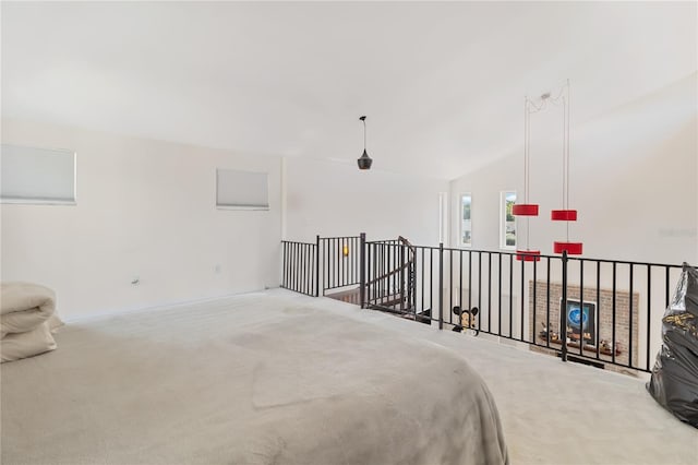 carpeted bedroom featuring lofted ceiling