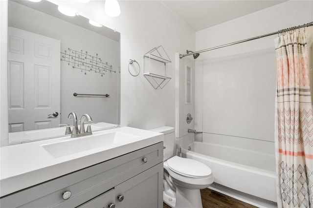 full bathroom featuring shower / tub combo with curtain, vanity, wood-type flooring, and toilet