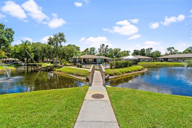 exterior space featuring a yard and a water view