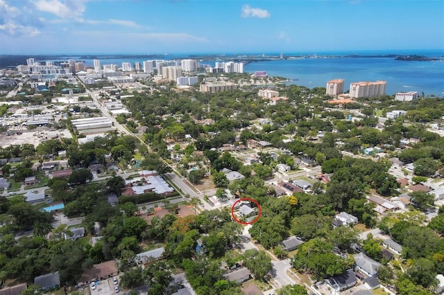 birds eye view of property with a water view