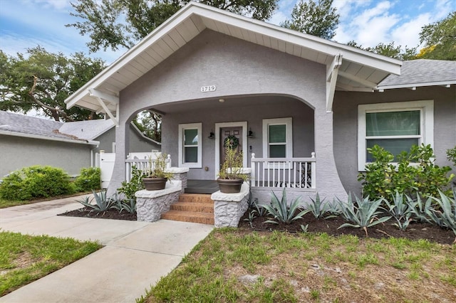 bungalow-style house featuring covered porch