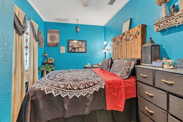 bedroom featuring ceiling fan and ornamental molding